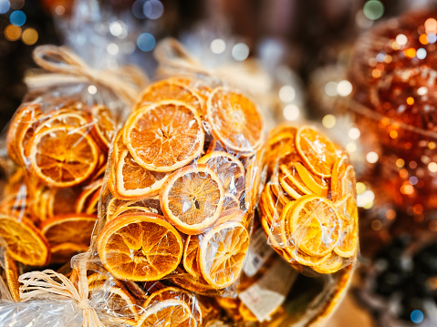 Bags containing slices of dried, scented orange fruit for sale in the Christmas store.