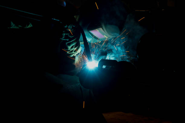 istock sparks while welder uses torch to welding 1805732863