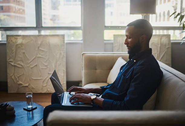 istock Productive Businessman Working on Laptop in Modern Office Space 1805743627