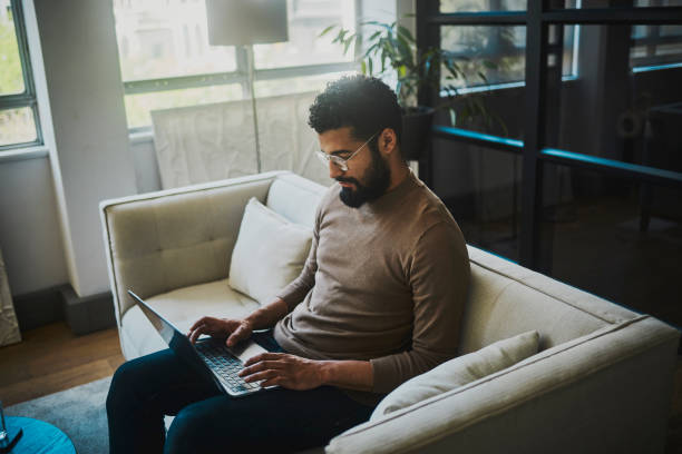 istock Productivity Unleashed: Modern Businessman Seamlessly Balances Work and Comfort. 1805744332
