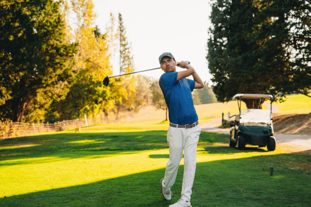 A golfer just after shooting the ball