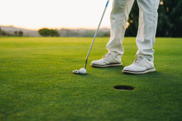 istock Closing putt on the green 1805751548
