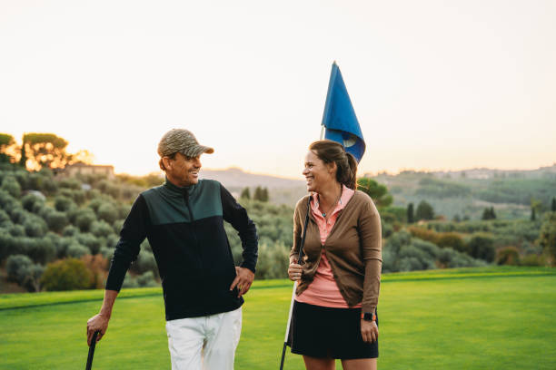 istock Two golf players are standing on the green 1805751559