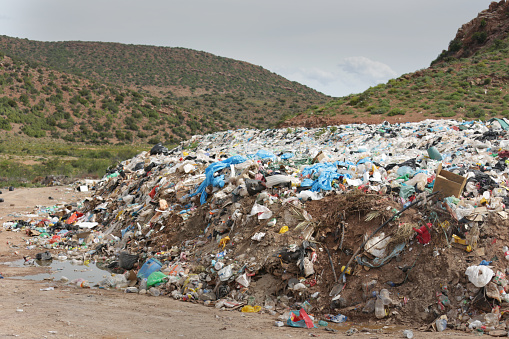 A garbage dump, landfill in a rural location