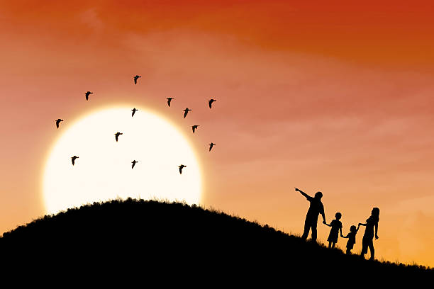 istock Happy family silhouette with sunset landscape 180579671