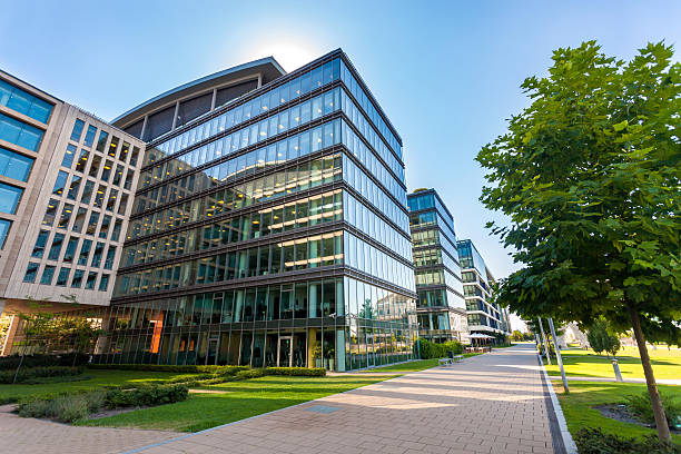 Alley with modern office buildings Alley with office buildings in modern Budapest area office building exterior photos stock pictures, royalty-free photos & images