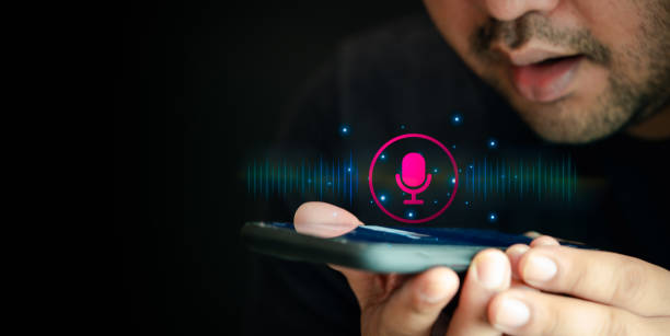 istock Man using utilizes his smartphone as an AI assistant. Use your voice to direct 1805799542