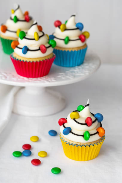 istock Christmas cupcakes decorated with candy Christmas lights 1805800090