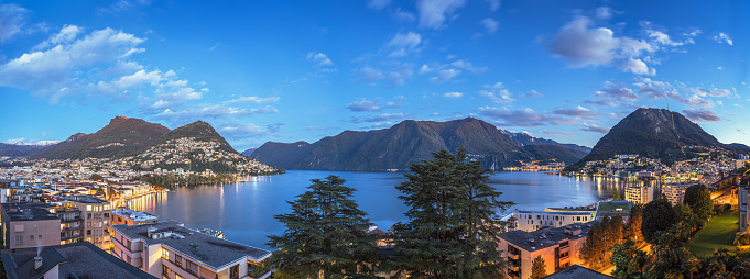 Lugano, Switzerland on Lake Lugano at blue hour.