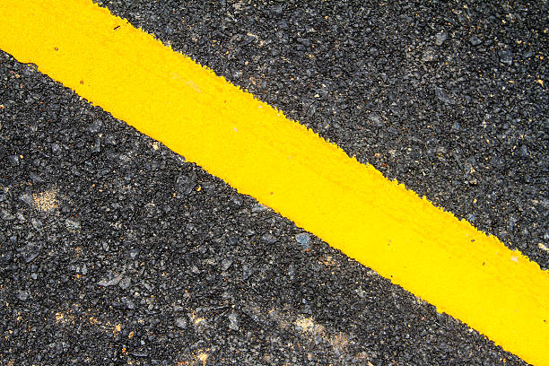 istock New asphalt texture with yellow line 180582596