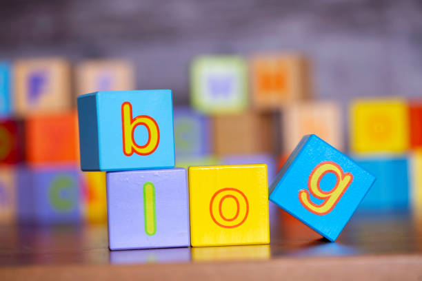 Wooden alphabet block with blog write