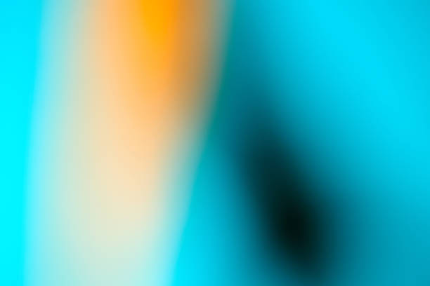 Abstract defocused lens yellow and blue light gradient background.