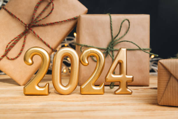 istock Background for greetings with empty space. Happy new year card. Figures 2024 on a light wooden background 1805840979