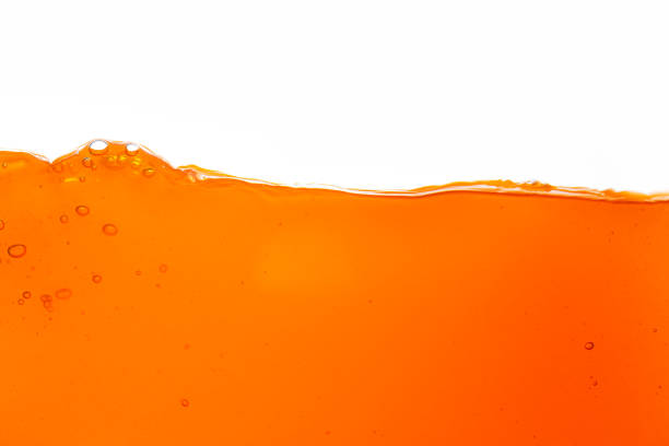 istock Orange juice isolated white background,orange juice texture on white background,Close up bright orange juice texture for health and nature waves 1805851624