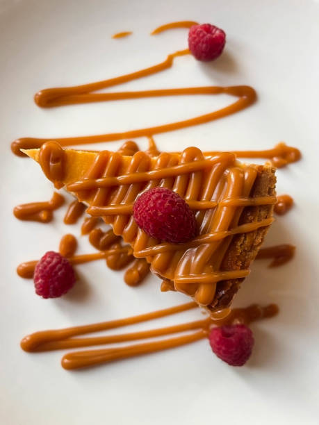 istock Caramel cheesecake with raspberries 1805861145