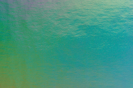 Green gradient metal texture background close up view