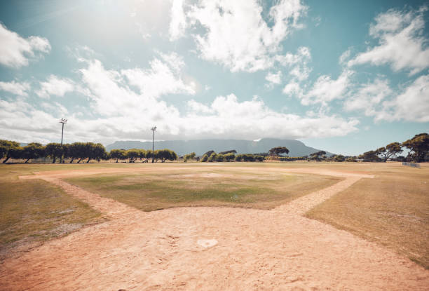 istock Empty baseball field, stadium or sport softball park for competition, training or tournament match. Sports, ball game or exercise, recreation or grass lawn nature area with pitch circle blue sky view 1805868911