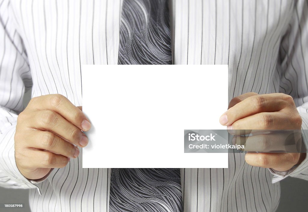 handing a blank business card over Business man handing a blank business card over Advice Stock Photo