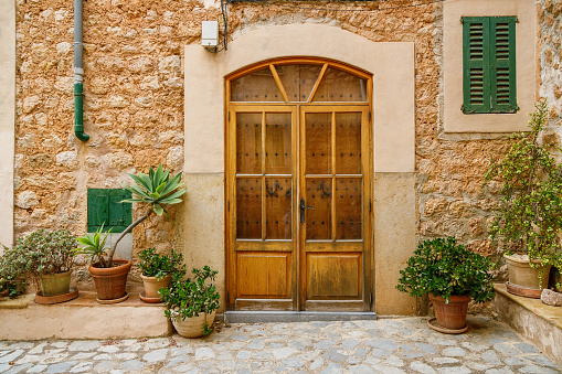 Beautiful typical entrance to the house with flowers in Fornalutx, Mallorca, Spain