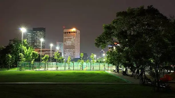 Photo of Outdoor sport stadium at night in the park
