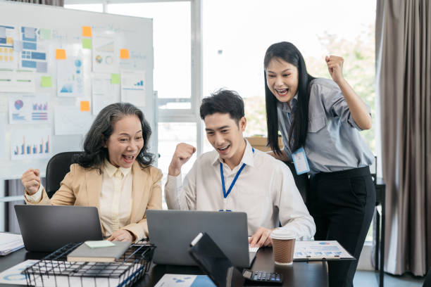 istock Happy smiling businessman feel happy work complete Teamwork success, success at work in the office concept. 1805912532