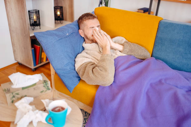 istock Young adult feeling sick at home 1805932017