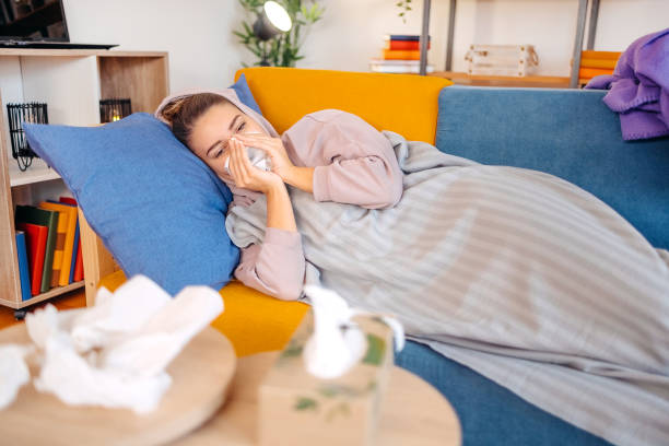 istock Young adult feeling sick at home 1805933274