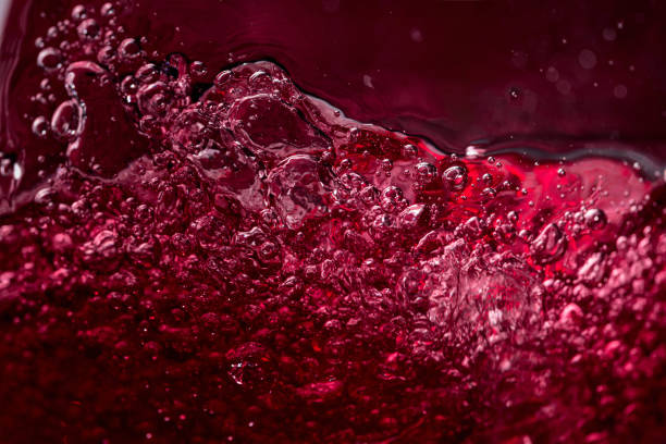 Abstract splashing of red wine. stock photo