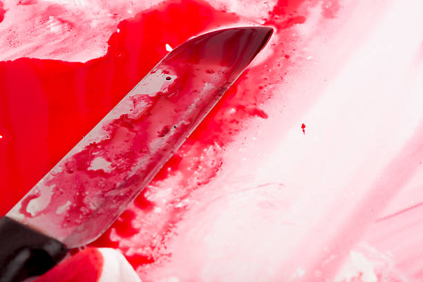 Halloween concept : Bloody knife with blood splatter