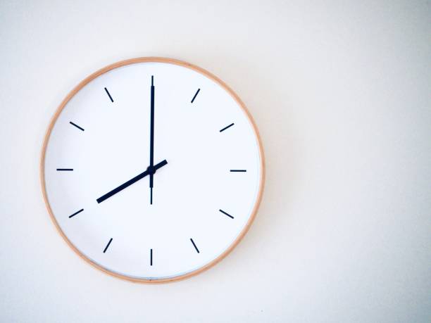 istock Minimal wall clock on the wall showing time 8.00 (20.00) 1805949736