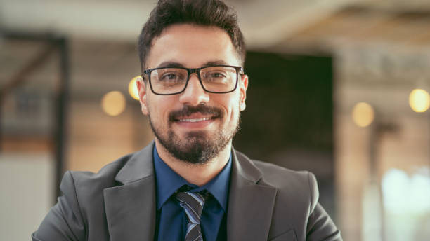 istock Businessman smiles at the camera 1805950939