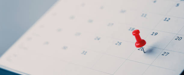 istock Embroidered red pins on a calendar event Planner calendar,clock to set timetable organize schedule,planning for business meeting or travel planning concept. 1805953258