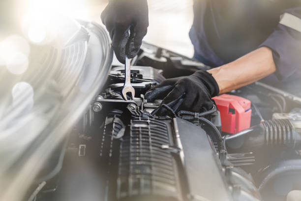 istock Car care maintenance and servicing, Close-up hand technician auto mechanic using the wrench to repairing change spare part car engine problem and insurance service support. 1805953802