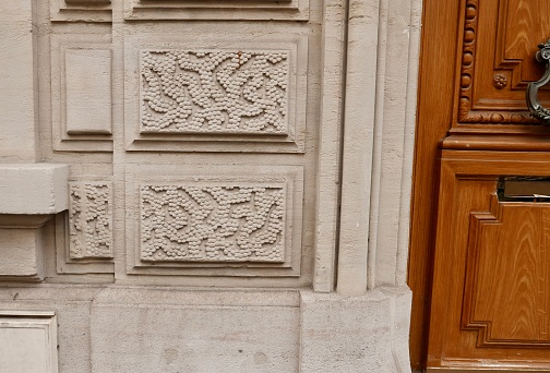 Typical Parisian Hausseman style building with a wood door