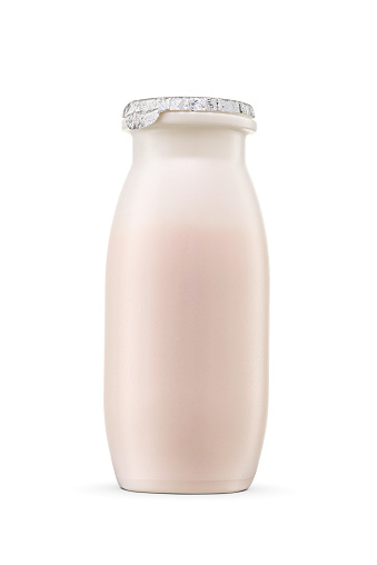 White plastic bottle of drinkable yogurt isolated on white background. Foil lid.