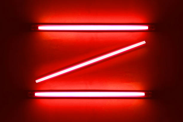 istock red neon bulbs on white wall. Background texture of empty old wall with glowing red neon bulbs. 1805989836