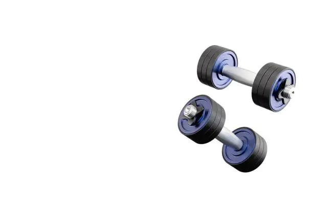 Photo of Two flying metal dumbbells. 3d rendering