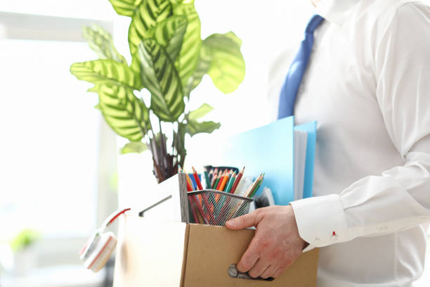 istock Fired man carrying box with personal belongings 1805994404