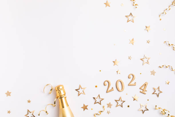 creative christmas and new year composition with golden champagne bottle, party streamers, confetti stars and 2024 numbers top view. - confetti new years day new year christmas imagens e fotografias de stock