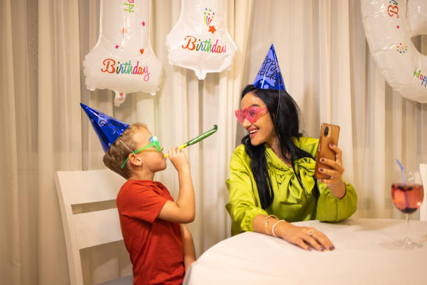istock Aunt taking selfie, while her nephew celebrating his birthday 1806008300