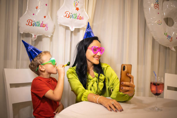 istock Mother taking selfie, while her son celebrating his birthday 1806009987