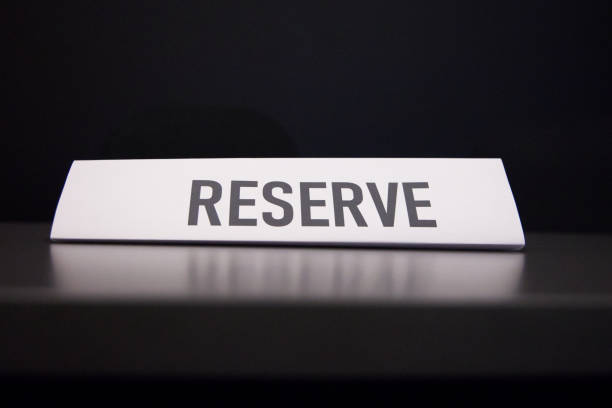 istock reserve table sign paper seating organization black background 1806028924