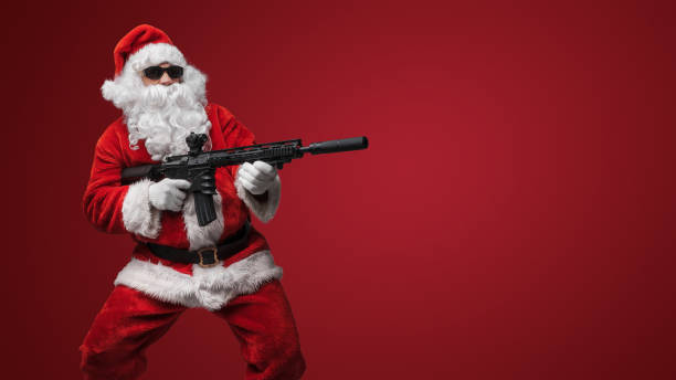 istock Festive Santa Claus with Toy Rifles 1806030048