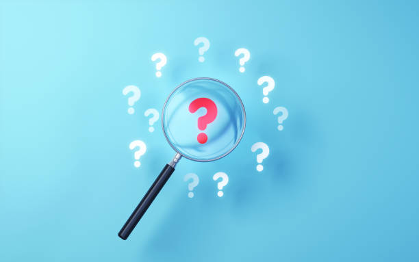 istock Red Question Mark Icon selected with metallic magnifying glass on soft blue background 1806030060