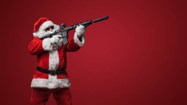 istock Festive Santa Claus with Toy Rifles 1806031208