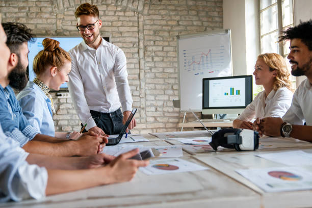 istock Group of multiethnic business people brainstorming, analyzing financial reports in office 1806034979