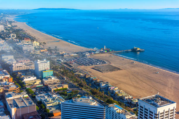 Aerial still image of the Santa Monica Pier fishing platform on a sunny day in Santa Monica, California.