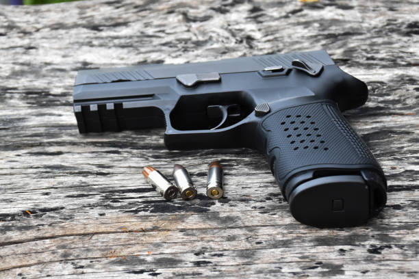 istock Automatic black 9mm pistol gun and bullets 1806055473