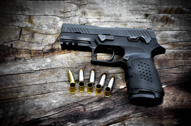 istock Automatic black 9mm pistol gun and bullets 1806056126