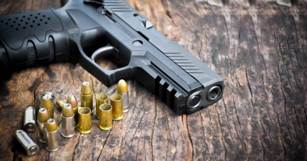 istock Automatic black 9mm pistol gun and bullets 1806056129